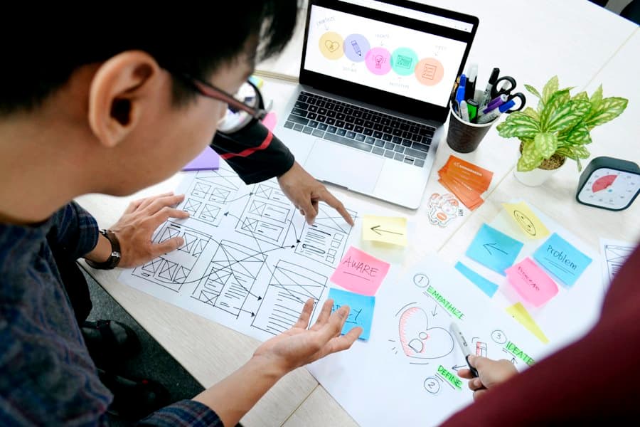 Designer sketching wireframes at a desk